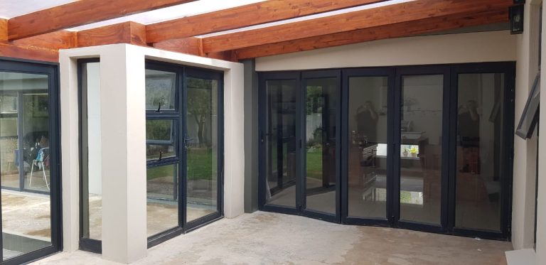 New black aluminium doors installed around a patio